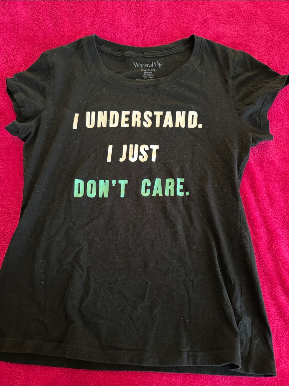 Wound Up Black Tee with White and Teal Text
